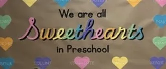 Hand-painted banner reading "We are all sweethearts in preschool", surrounded by pastel candy hearts with a child's name on each.